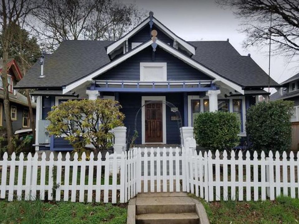 Classic Craftsman with white picket fence