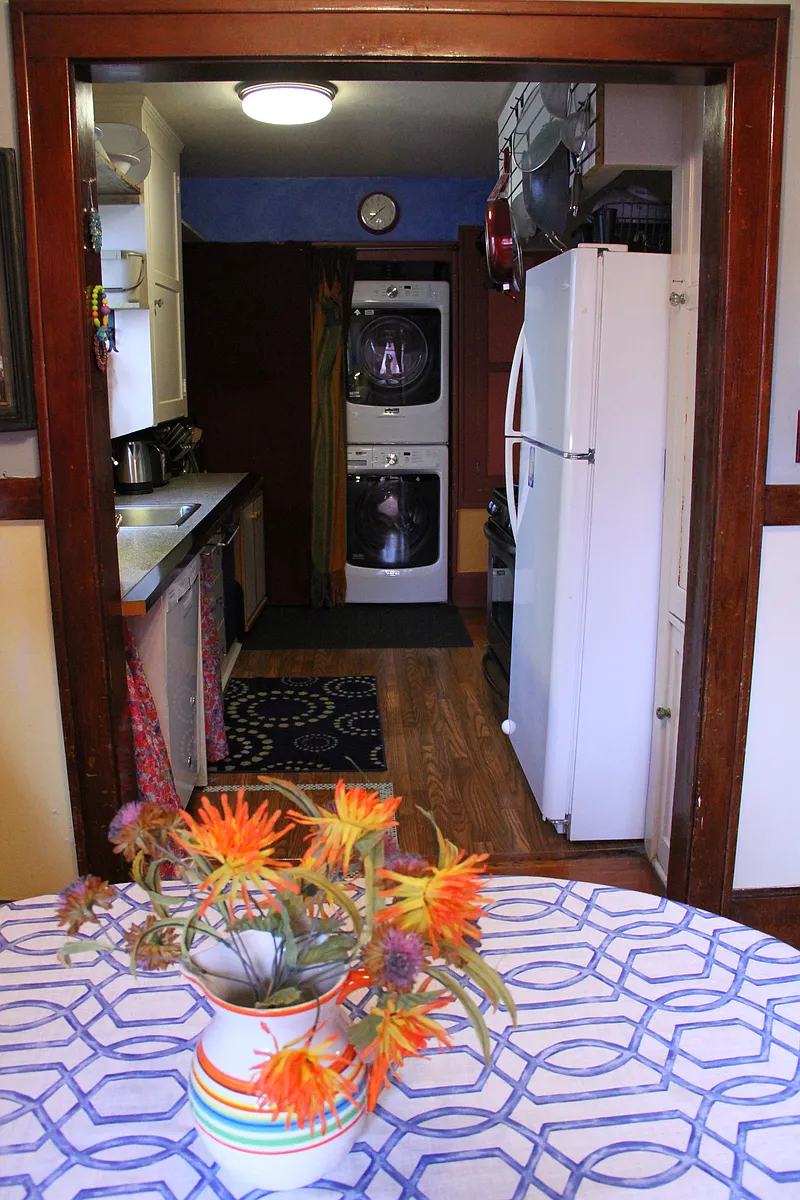 Just off the dining room, the kitchen has everything you need, where fun meets function: dishwasher, washer and dryer, gas stove, and a spacious fridge ready for your favorites - 3964 N Michigan Ave #A