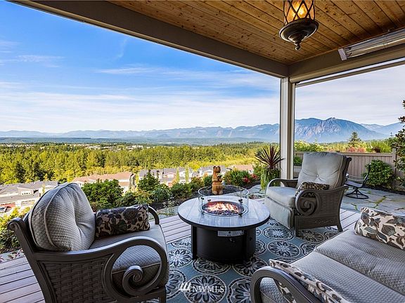 All weather patio heaters in the ceiling and electric screens that come down to make it even more cozy.