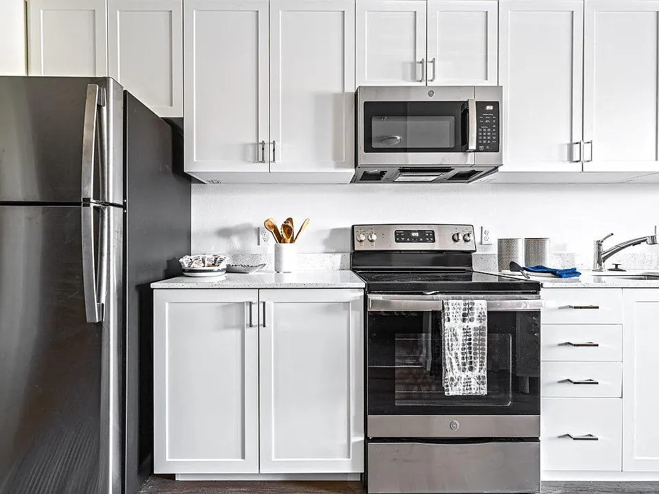 Bright kitchens featuring stainless steel appliances