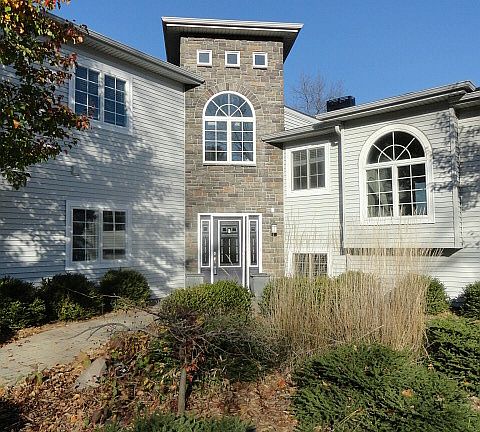 This elegant entrance with beautiful gardens in every direction brings the "icing on the cake" to th