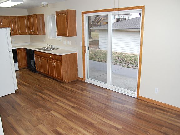 Kitchen/dining room with walkout doors to the covered patio area.