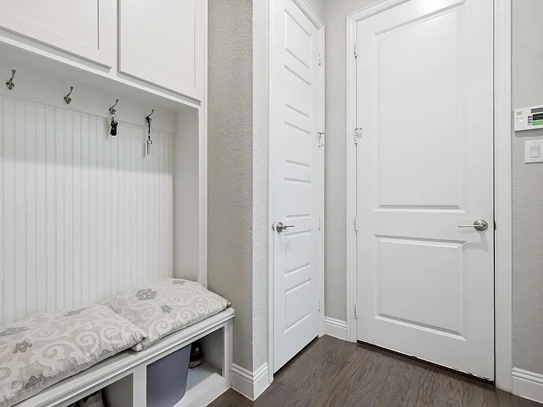 Mudroom is convenient as you enter from the garage for backpacks, purses and keys.