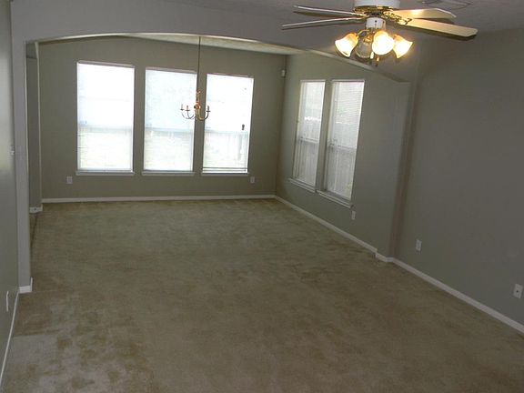 Beautiful arched walkways and ceiling fans.