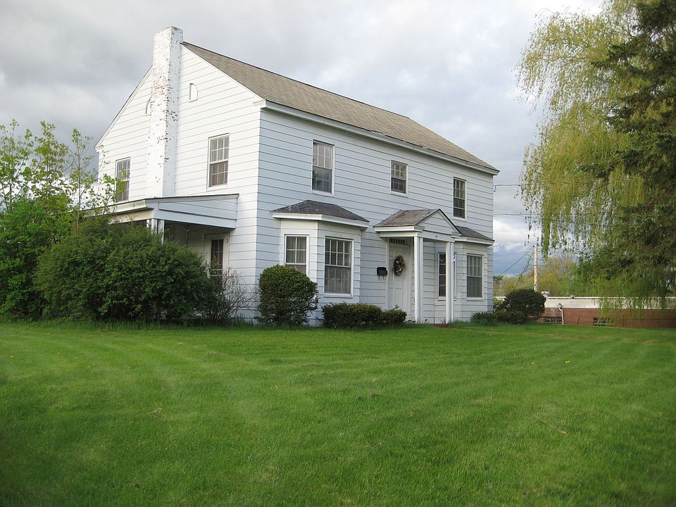 Large Colonial perched on a hill has loads of charm and character!