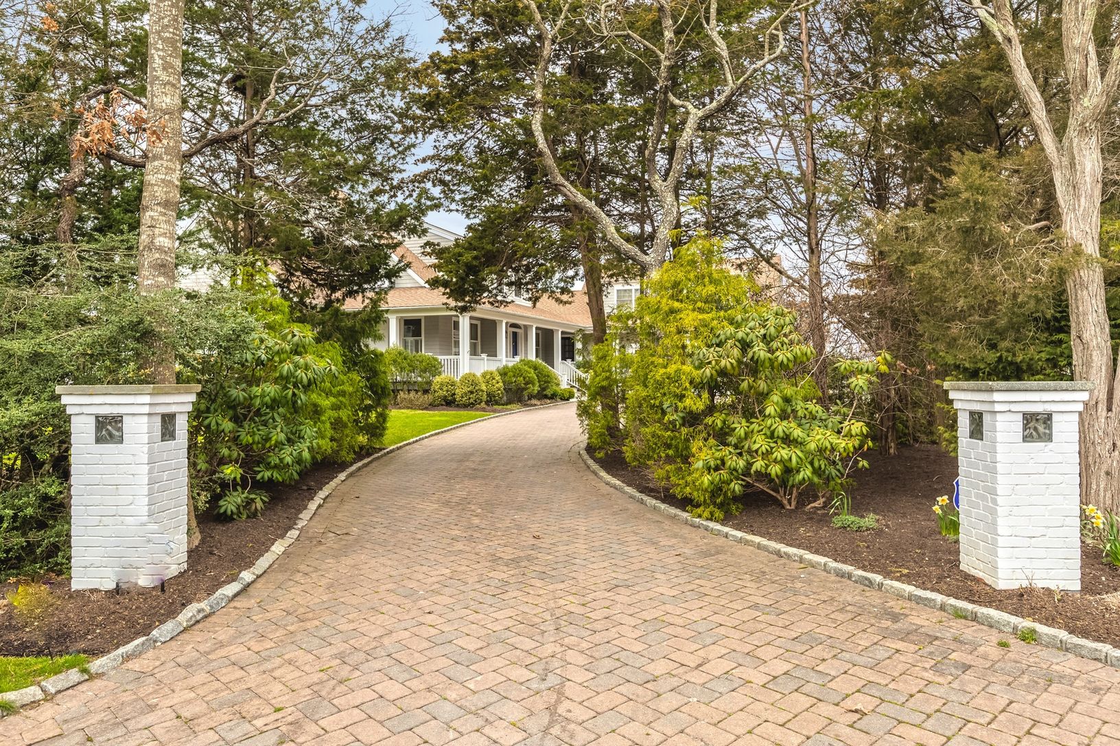  Long driveway leads to plenty of parking and 2 car garage