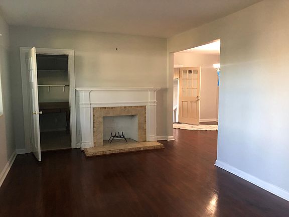 Front entrance walk in to living room. Office/indoor laundry to the left of fireplace