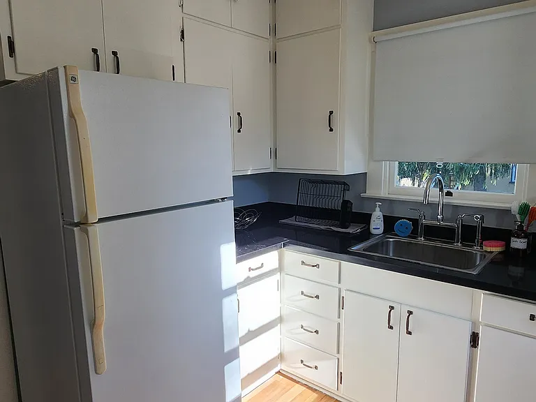 Another view of the kitchen and its storage.