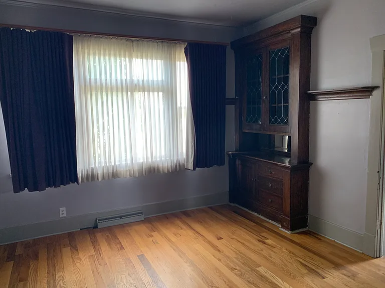 Dining room with built in storage and west facing bay windows