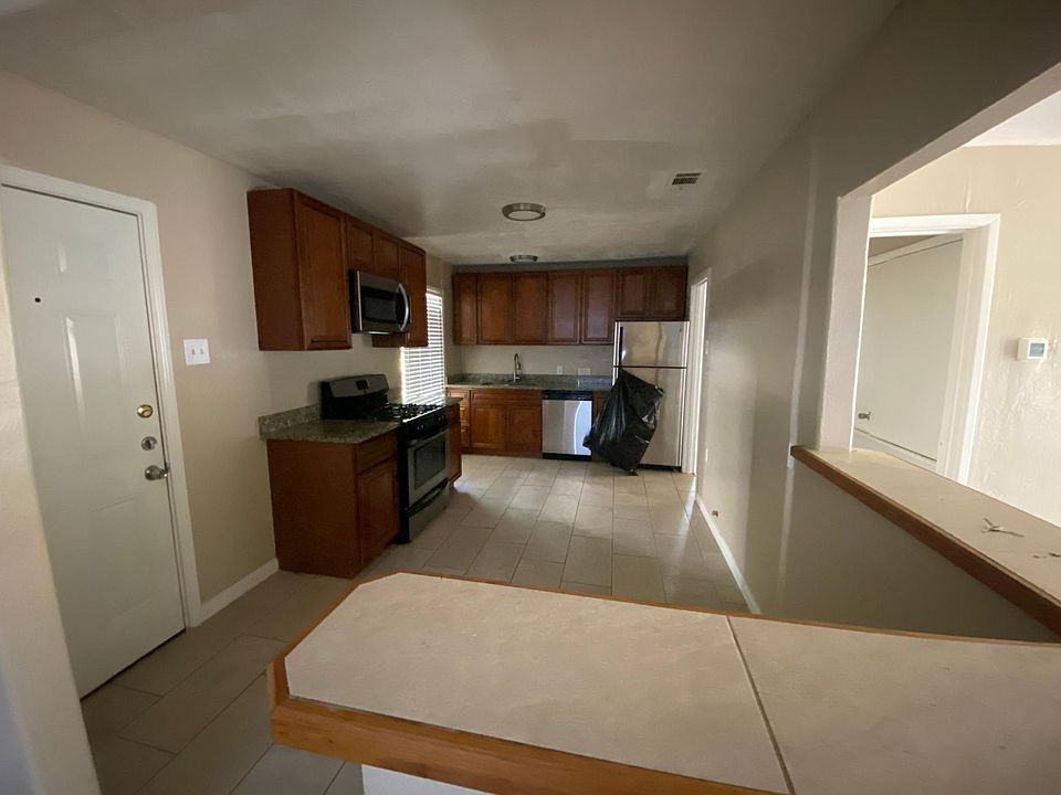 Kitchen with stainless steel appliances, soft close cabinets and granite countertops