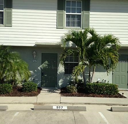 ENTRY W MINI PALMS & HIBISCUS LINED WALKWAYS