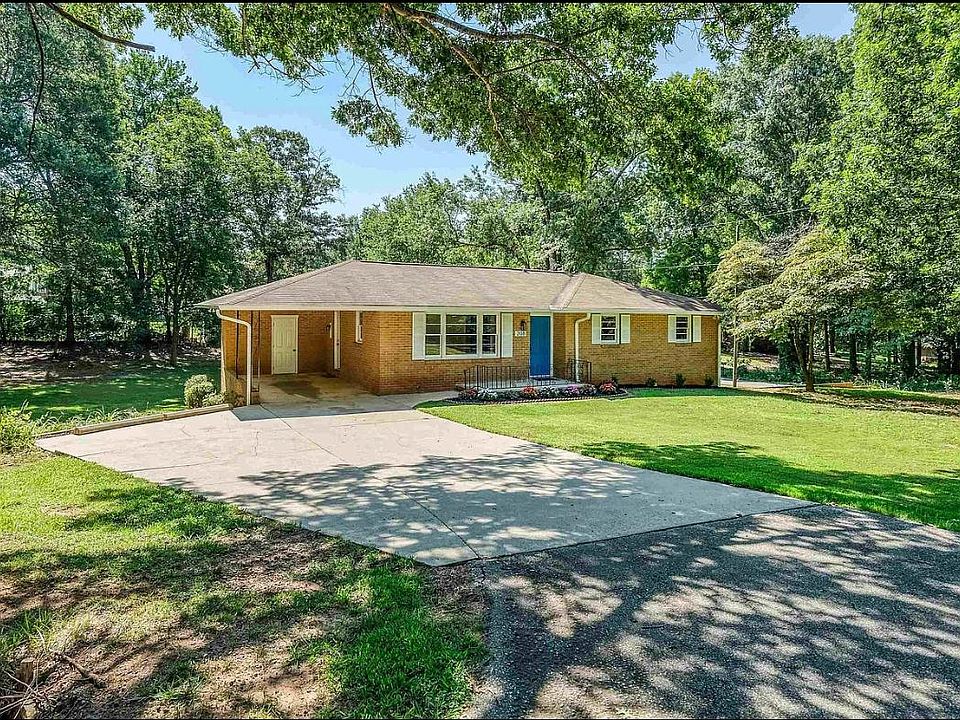 Front view with carport and ample parking