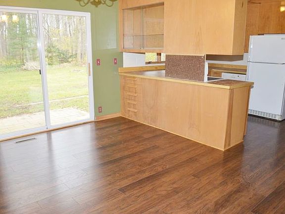 The dining area has a patio door leading to the private back yard.