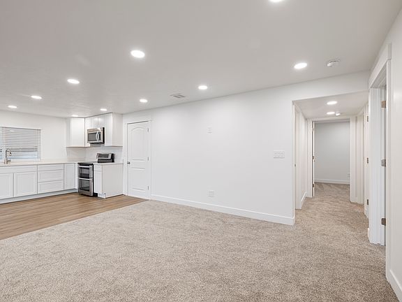 Hallway to bedrooms, bathroom, and storage.