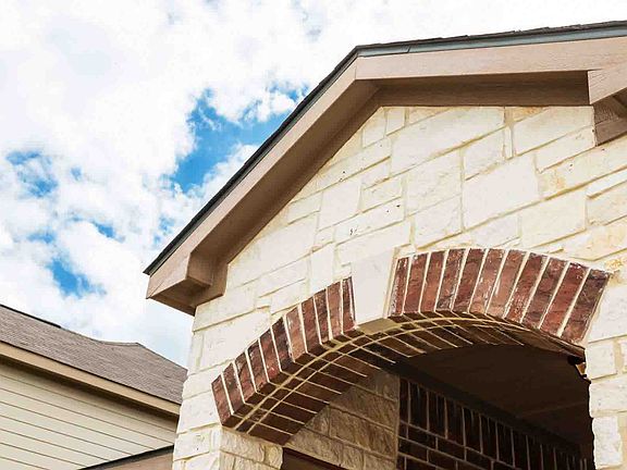 Beautiful brick and stone covered porch entrance