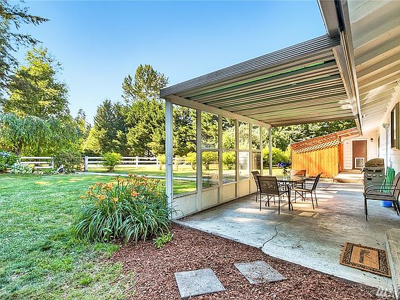 Useful covered back patio - great for year-round gatherings.