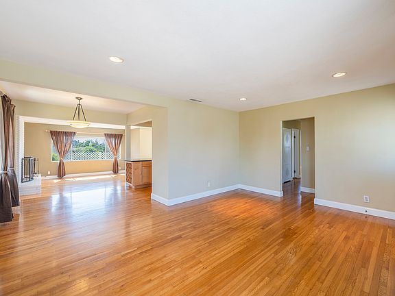 Living room with dining room next to kitchen