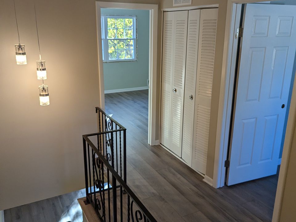 Upstairs hallway with linen closet