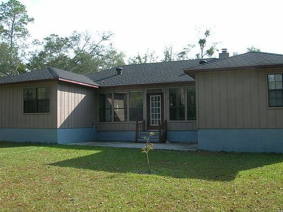 Back of house with open patio