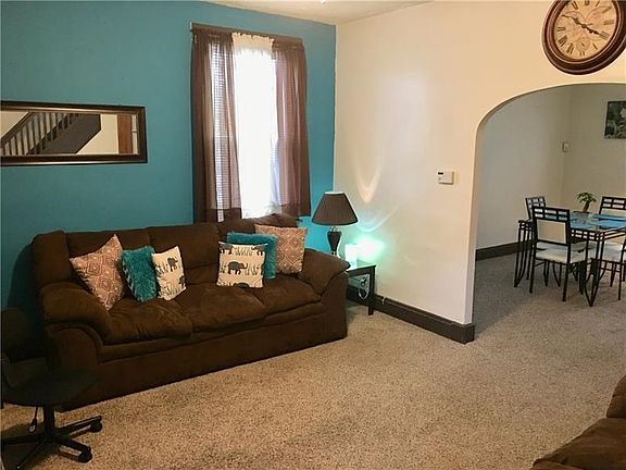 Beautifully maintained living room with newer carpet.