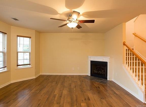 Roomy Living Room With Bay Window And Fireplace