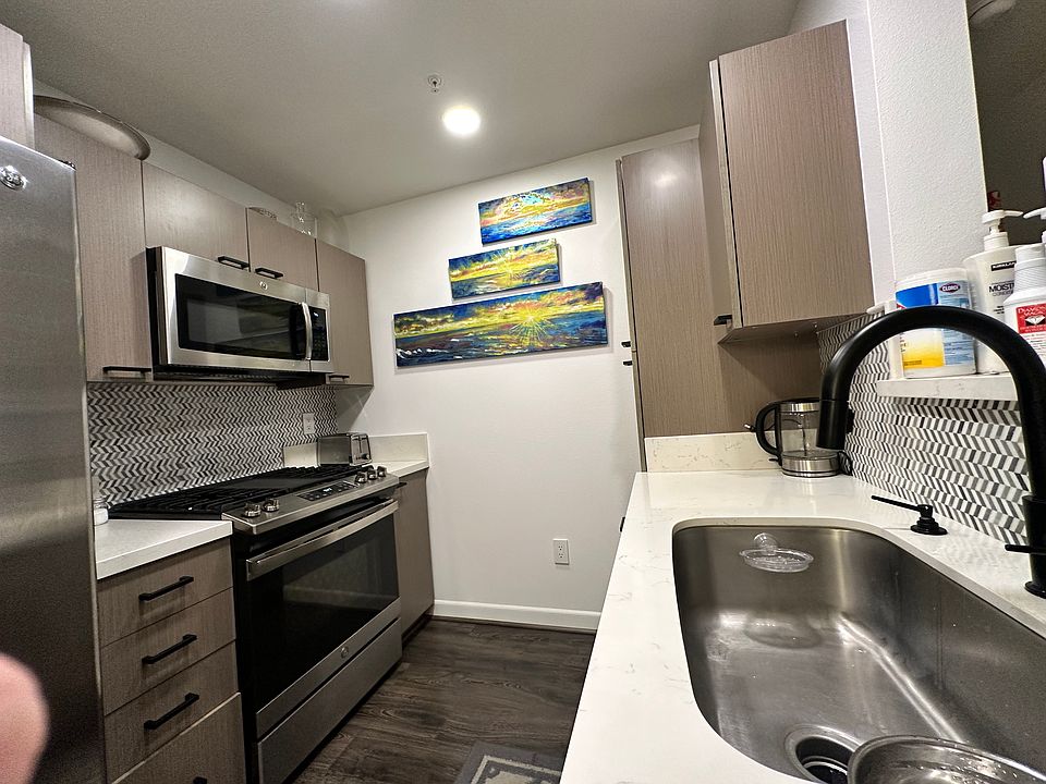 Updated kitchen with gas oven and 5 burner cooktop, microwave, side by side refrigerator w/ice & water dispensor, garbage disposal and bosch 3 rack stainles steel diswasher.