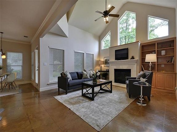 Beautiful living room with soaring ceilings and great natural light