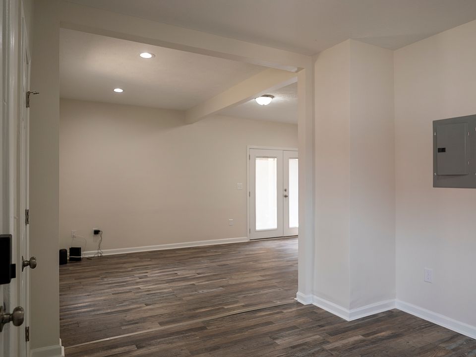 Bright, spacious dining and living area. Kitchen is back to the right in this image.