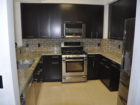 Kitchen with all stainless steel appliances.