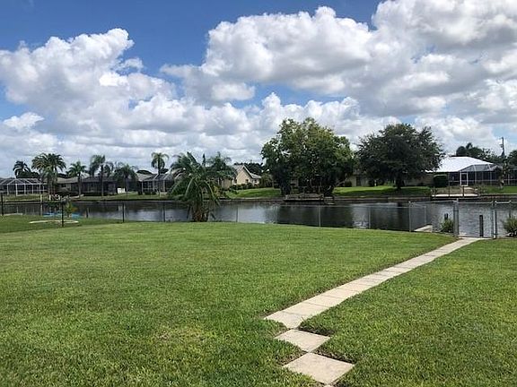 One of the largest backyards in the neighborhood, completely fenced with a banana tree in the corner.