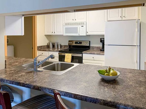 Our kitchens combine modern convenience with ample counter space - perfect for both meal prep and casual dining.