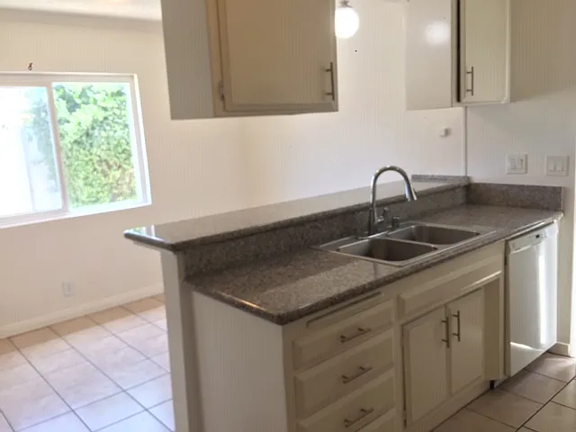 kitchen sink with granite countertop