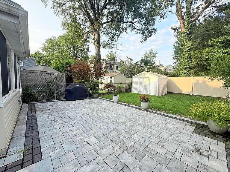 Fenced in Backyard with Paver Patio, Grill, and Shed
