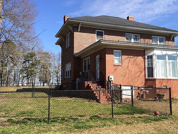 Back of house with dog run
