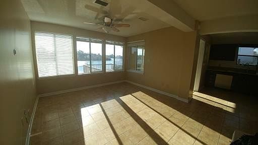 Living room with lots of natural light and view of lake.