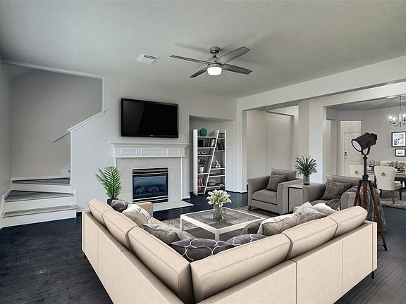 Living room features gas log fireplace.