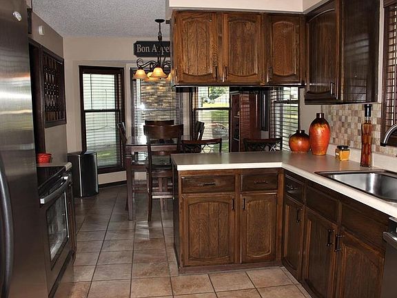Updated Kitchen! Stainless appliances stay. Updated tile backsplash & tile floor.
