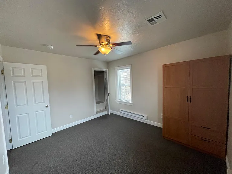 Upstairs bedroom with closet and armoire included