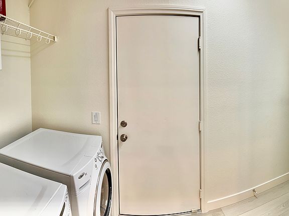 Laundry room / mudroom with storage cabinets