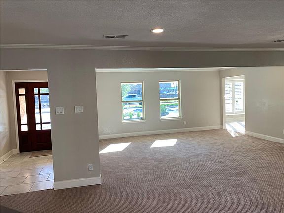 A view showing from entry all the way to the front formal dining room. Notice all that natural light!
