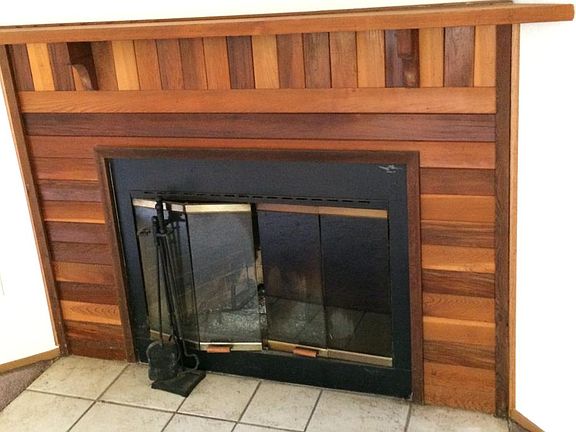 Wood burning fireplace in living room