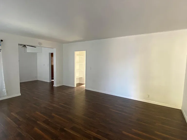 Living room with opening to dining area