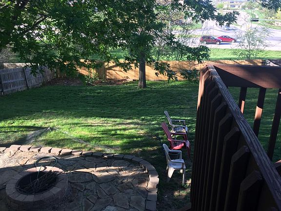 Fire pit, stone patio area, deck, garden plot and big fenced