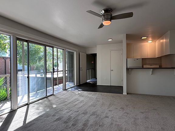 Looking back across the living space to the kitchen and entry. Just next to the kitchen is the pantry.