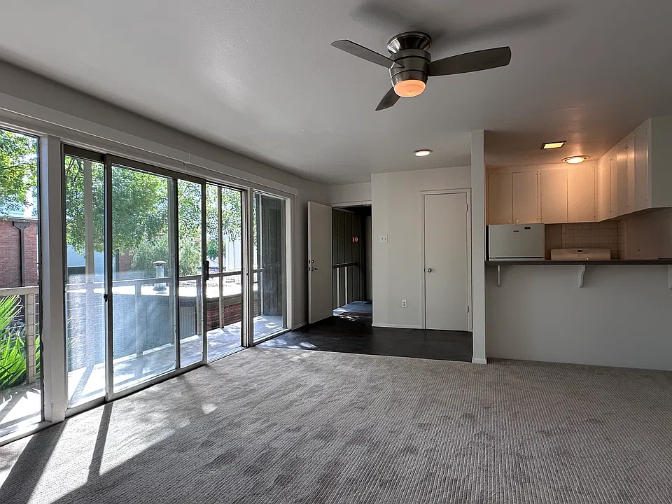 Looking back across the living space to the kitchen and entry. Just next to the kitchen is the pantry.