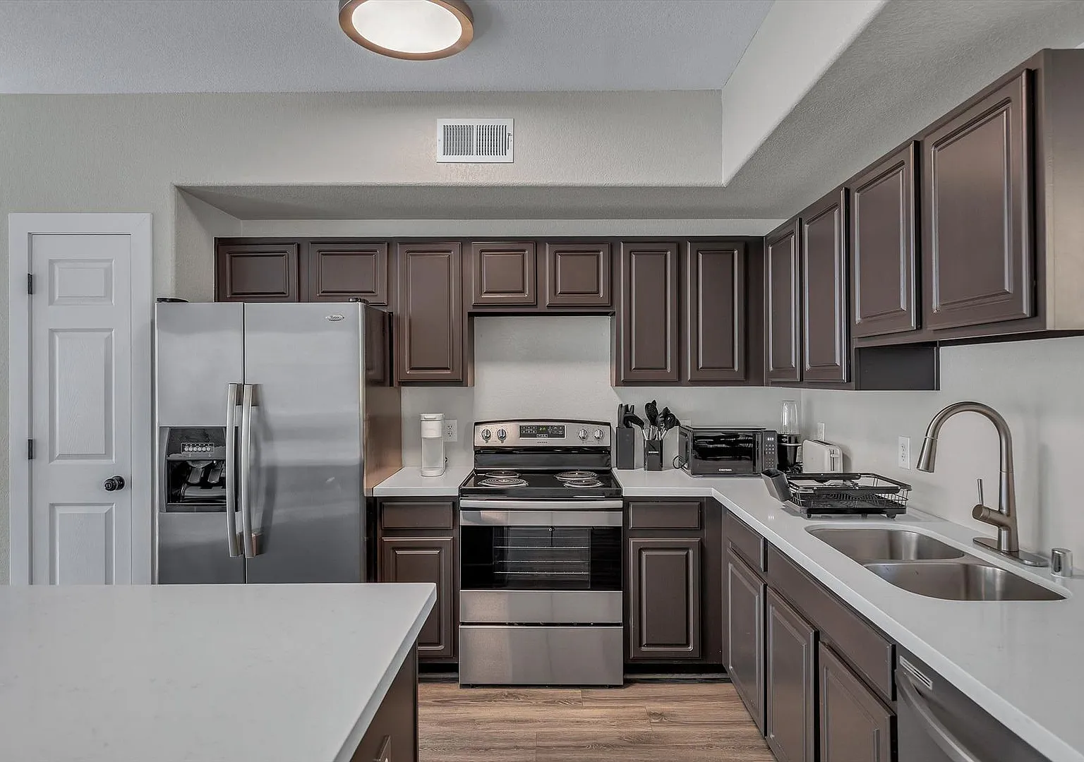 Updated 2 Bedroom 2.5 Bathroom Gated Community Home W/ Two Car Garage — Photo 1