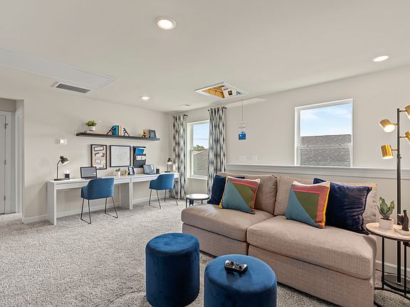 Upstairs, the large loft can accommodate a work study area and media space.