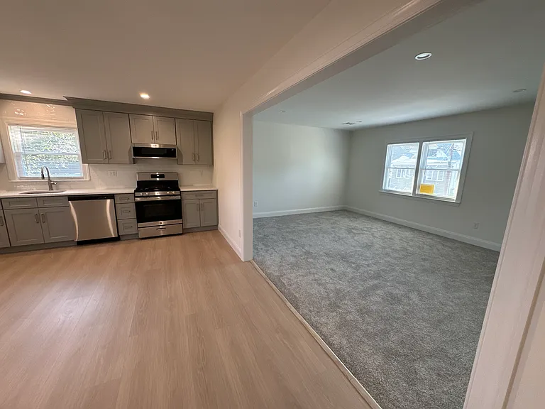 Brand new floors and new carpet.
Kitchen open to the living room.