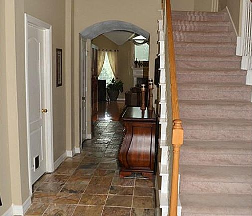 Slate Floors Lead to Hardwood in Large Family Room