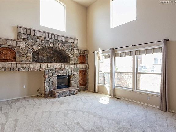 Stunning custom-made fireplace wall is sure to be a conversation piece!